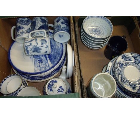 Two boxes of assorted blue and white tea bowls, mugs, teapot etc.