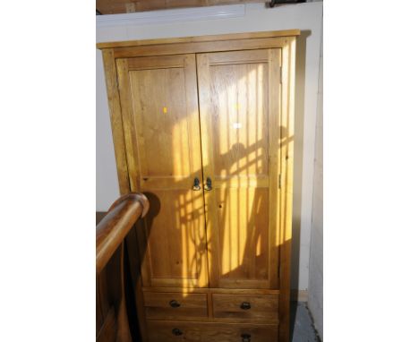 Modern light oak double door wardrobe with two short drawers above single long drawer