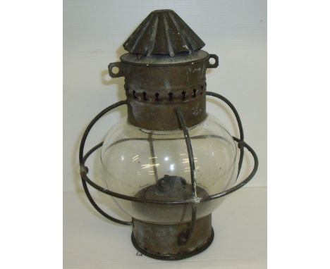 Ships paraffin lantern with glass globe within a wire cage