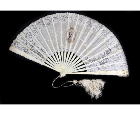 A Late 19th Century Point De Gaze Needle Lace Fan Mounted on Ivory, the sticks gilded, the guards elaborately carved with cup
