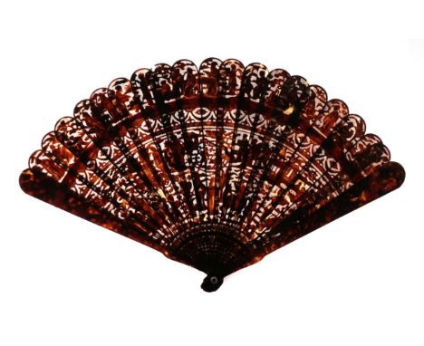 A Circa 1840's Chinese Carved Tortoiseshell Brisé Fan, Qing Dynasty, with 19 inner sticks and two guards. The sticks are carv