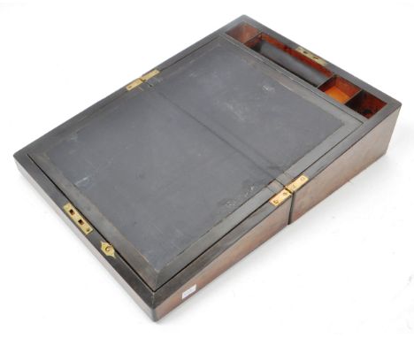 A vintage 19th century wooden walnut writing slope box. The box with brass brackets and decorative features. Featuring a blac
