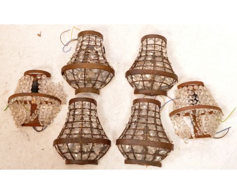 A collection of 20th century French empire wall light shades - chandeliers. Each with banded metal construction being strung 