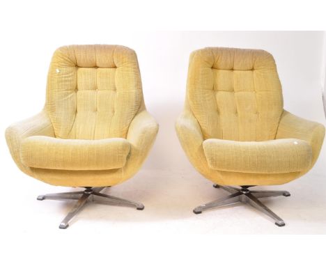 Greaves &amp; Thomas - A pair of mid 20th century Greaves &amp; Thomas egg chair manner retro swivel armchairs. Raised on fou