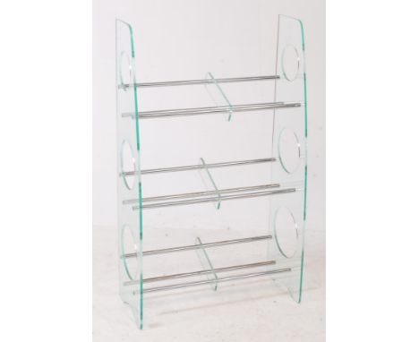 British Modern Design - A contemporary perspex and tubular chrome book trough - bookcase stand. Perspex upright pierced sides