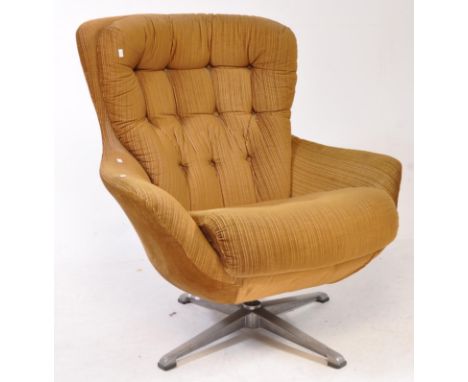 Manner of Greaves &amp; Thomas - A mid 20th cenutry Greaves &amp; Thomas egg chair manner retro swivel armchair. Raised on fo