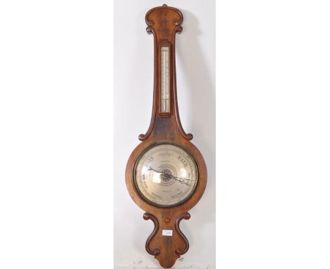 A George III 19th century mahogany hanfing wall hanging barometer. Made by P. Dold of Colchester. Featuring a glass casing wi