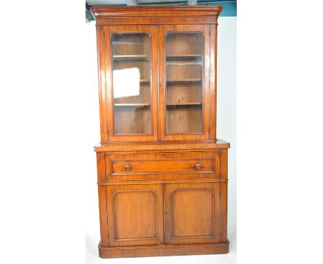 Victorian 19th century mahogany library bookcase secretaire. The bookcase with twin doors and flared cornce. Below, a secreta