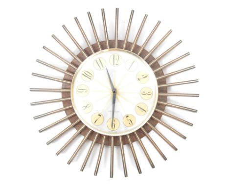 Westclox - A vintage 1970s sunburst wall clock. Featuring a plastic body with wood effect and gold decoration to the slats an
