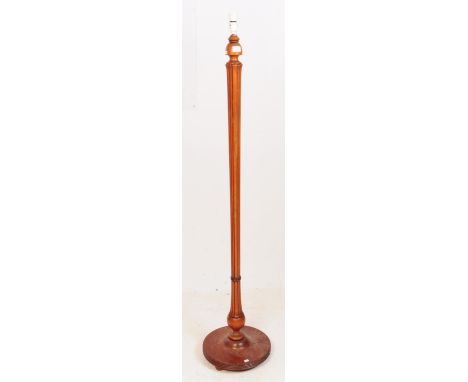 An early 20th century 1930s mahogany Art Deco style standing standard floor lamp. The lamp featuring a circular base with a c