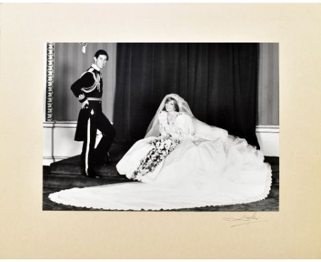 PATRICK LICHFIELD; a black and white wedding photograph of HRH Prince Charles and Lady Diana Spencer, signed in pen lower rig