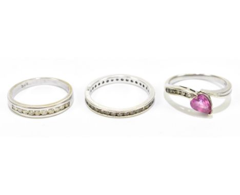 A 9ct gold and gem set ring, size M, gross weight 2.6g, with a white metal ten stone ring, stamped '750', gross weight 2.4oz,