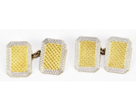 A pair of 18ct yellow gold and platinum cufflinks with engine turned decoration, approx weight 7.6g. cased.Additional Informa