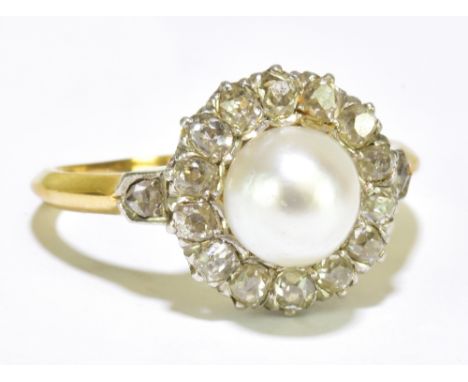 A circa 1900 French yellow metal diamond and pearl flower head ring set with old cut stones inscribed to the inner band '27 J