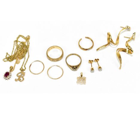 A quantity of 9ct yellow gold and yellow metal jewellery including a ruby pendant on chain, rings, ear studs, etc, total appr