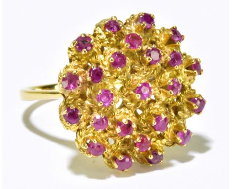 A yellow metal dress ring with textured large circular platform with pale pink stones, size M, diameter of head 20mm, approx 