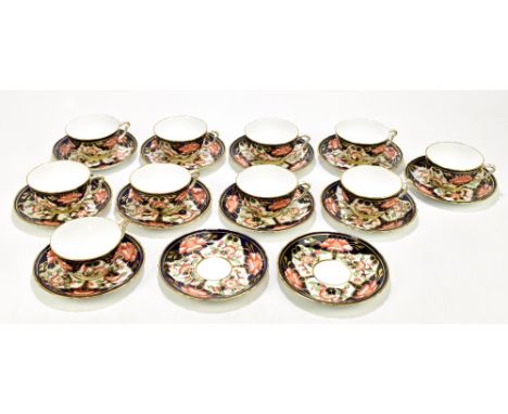 ROYAL CROWN DERBY; a set of ten tea cups and twelve saucers decorated in the B453 pattern.Additional InformationLight surface