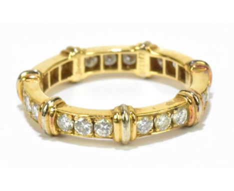 CARTIER; an 18ct yellow and white gold and diamond full set Eternity ring with rows of three brilliant cut diamonds and bi-co