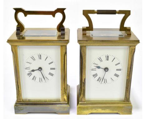 WJ HUBER; two early 20th century brass plated cased carriage clocks, each with enamelled faces and Roman numerals, height of 
