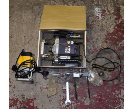 A Freud FT2000 VCE router, together with a modern De Walt router.NB: PLEASE SEE CONDITION REP FOR IMPORTANT INFORMATION REGAR