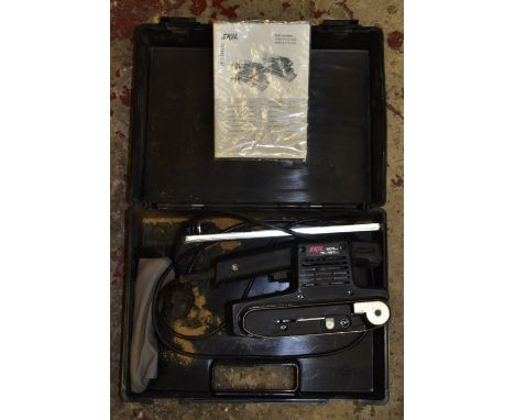 A 600 Skil belt sander, cased in plastic carrying box.NB: PLEASE SEE CONDITION REP FOR IMPORTANT INFORMATION REGARDING THIS L