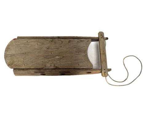 A vintage elm children's sled.