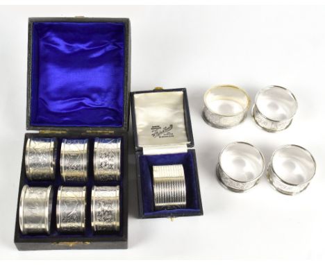 A part set of five Edwardian hallmarked silver napkin rings, with engraved vine leaf detailing, Birmingham 1904, in box with 