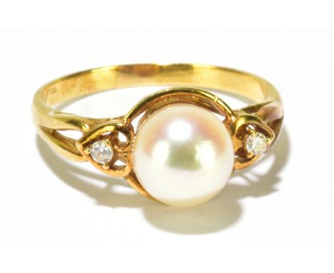 An 18ct yellow gold cultured pearl and twin diamond set ring, size O, approx 3.54g.