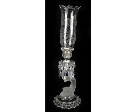 BACCARAT; a glass storm candlestick, modelled with an etched glass shade above a lustre drip pan and dolphin support with cir