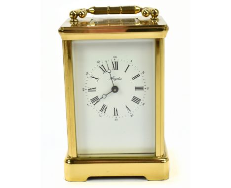ANGELUS; a modern gilt brass carriage clock with swing brass handle above the enamel dial set with both Roman and Arabic nume