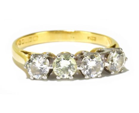 An 18ct yellow gold four stone diamond ring, each round brilliant cut stone weighing approx 0.20ct, size K, approx 2.7g.Addit