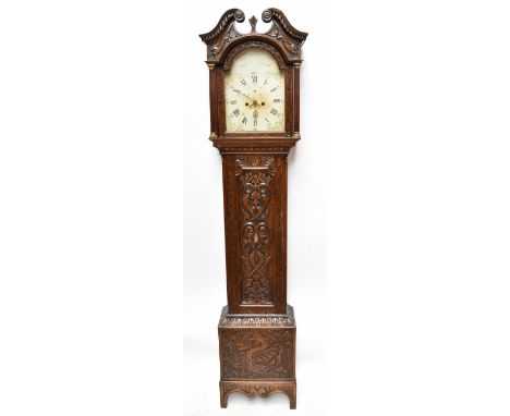 GODFREY WILLIAM WINTERTON; a carved oak eight day longcase clock.