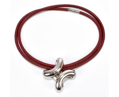 HERMÈS; a large Lima silver pendant with a red brown leather cord, the pendant marked '95&nbsp;Hermès', measures 4 x 4cm, cor