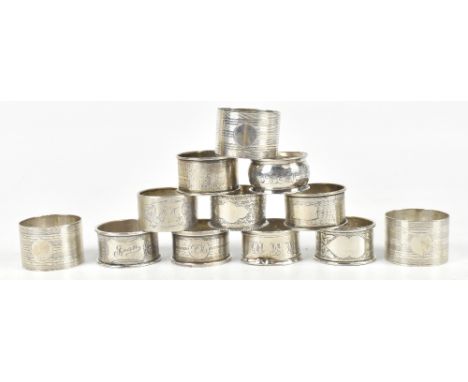 MAPPIN &amp; WEBB; a set of three George V hallmarked silver napkin rings with engine turned and linear decoration, together 