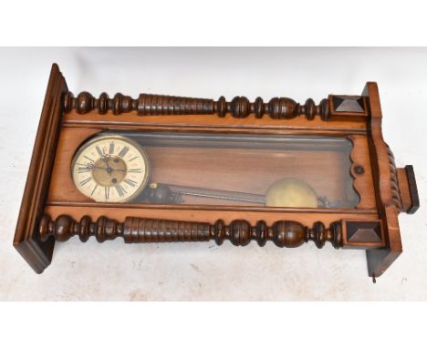 A walnut Vienna regulator style wall clock, with Roman numeral chapter ring and movement striking on a gong, height 94cm.&nbs