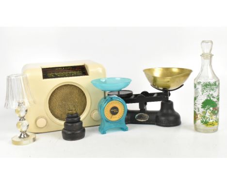 A cream coloured Bush radio, also a glass decanter, a glass candle holder, a set of scales and a further set of plastic scale