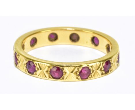 An 18ct gold and ruby eternity ring, size O, approx 4.17g.