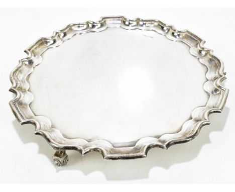 WALKER & HALL; a hallmarked silver salver, on three scroll feet, Sheffield 1966, weight 30ozt/940g, diameter 31cm. Additional