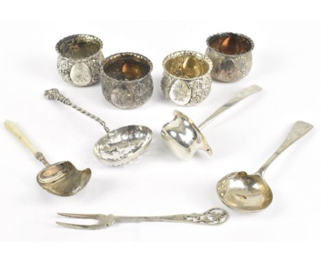 AITKEN BROS; a set of four Victorian hallmarked silver open salts with piecrust rims and repoussé floral decoration surroundi