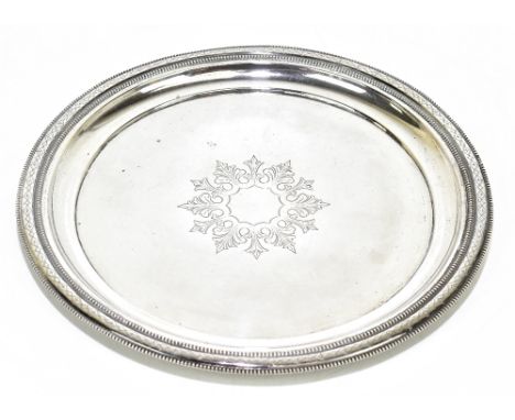 A Polish 800 grade circular silver tray with engraved stylised leaf detail to the central panel, stamped to the reverse 'Schi