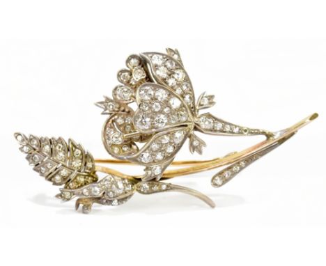 An early 20th century yellow and white metal diamond floral spray brooch, length 65mm, approx. 13.3g.Additional InformationTh