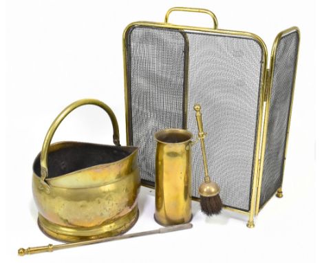 A brass coal bucket, a brass framed triptych fire screen and a part companion sets (4).