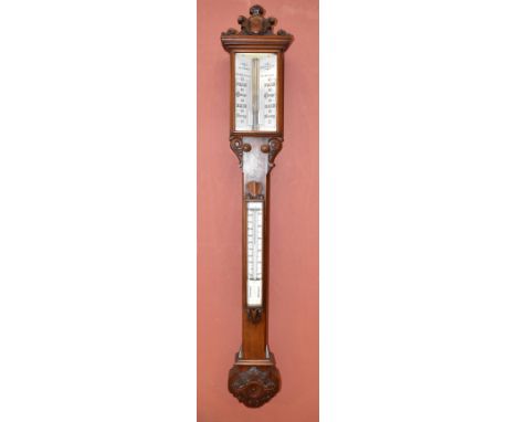 LYNCH &amp; BATEMAN OF MANCHESTER; a 19th century mahogany stick barometer, with carved detail to the top and edges, with whi