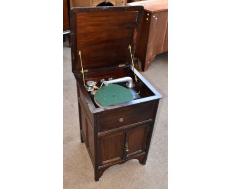 An early 20th century mahogany wind up gramophone cabinet, with hinged top and two panelled doors, height 73cm.