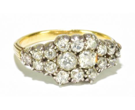 An antique yellow and white metal diamond ring, the cluster setting centred with twin old cut stones each weighing approx 0.2
