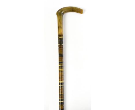 A sectioned horn walking stick with angled horn handle, length 85cm.