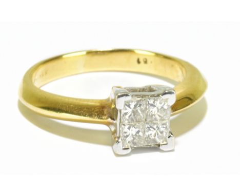 An 18ct yellow gold diamond ring set with four princess cut stones to the raised table, total diamond weight approx 0.51ct, s