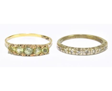 A 9ct yellow gold fine stone pale green dress ring size U, approx 2.43g, and a white metal dress ring, size S, approx 3.4g (2