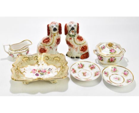 Two 19th century Staffordshire spaniels, one example holding a basket of flowers, together with an assortment of 19th century