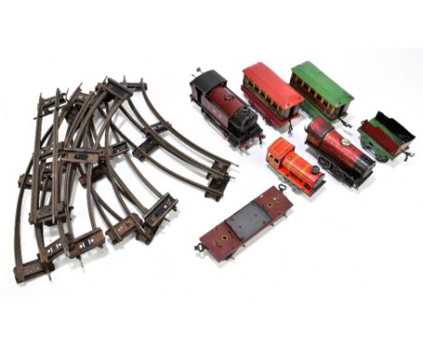 HORNBY; two tinplate steam engines, and three tinplate carriages, with further tinplate steam engine and track.&nbsp;